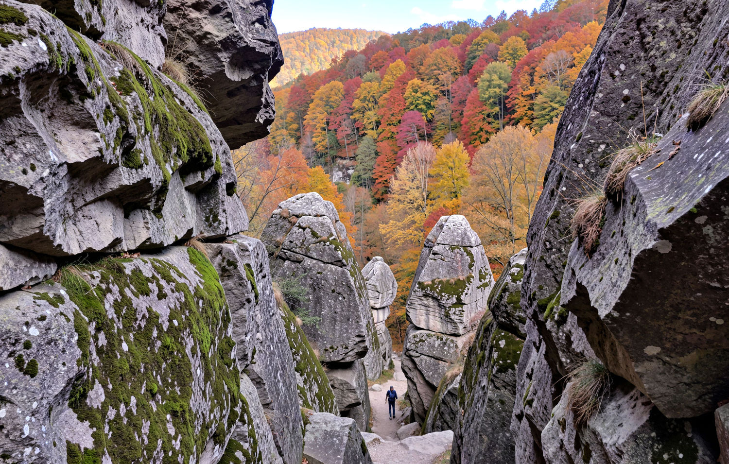 hiking trail between Mullerthal like rocks with tiny hiker